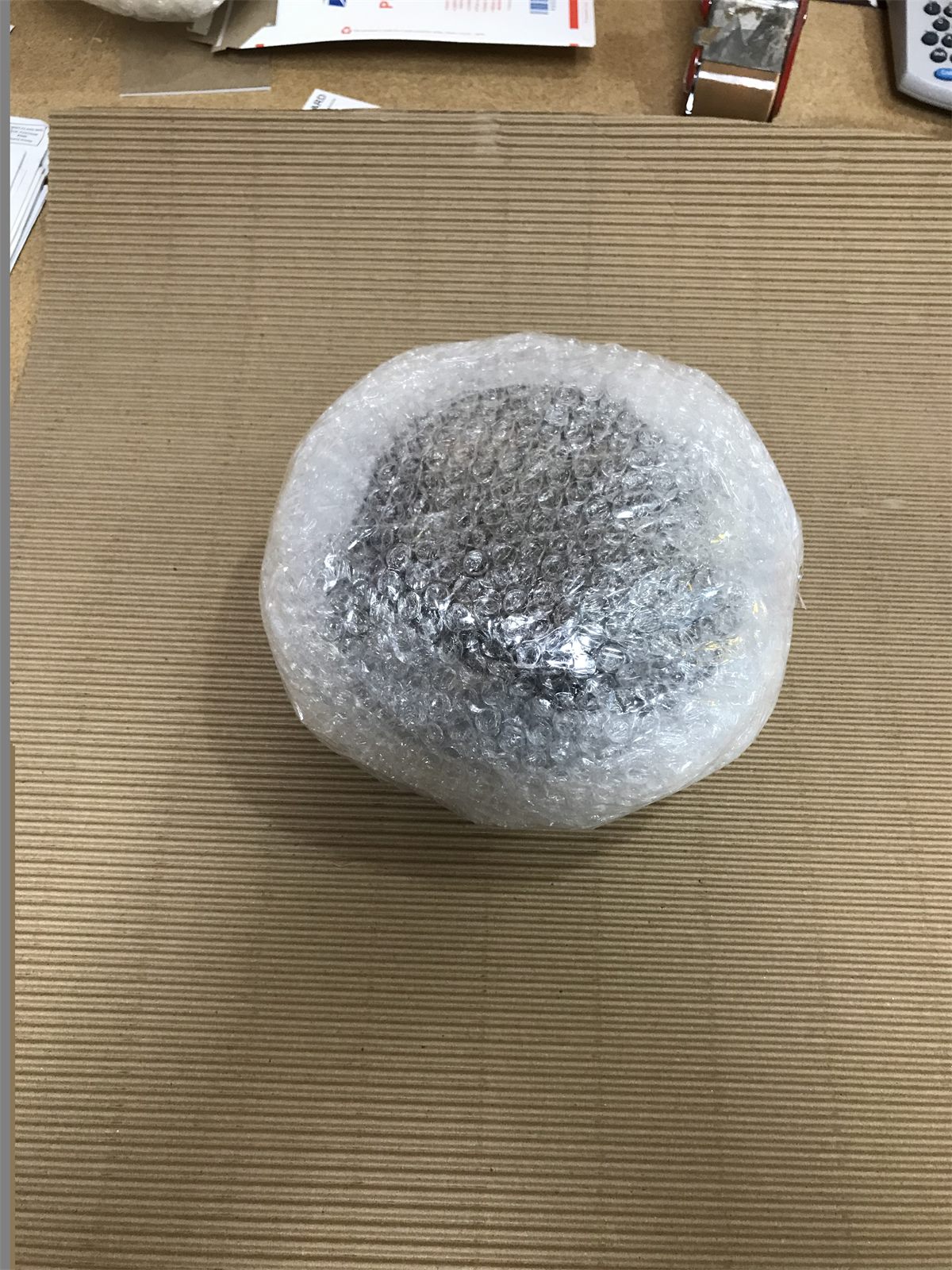 Fragile lamp or decor item wrapped with bubble protection before packing