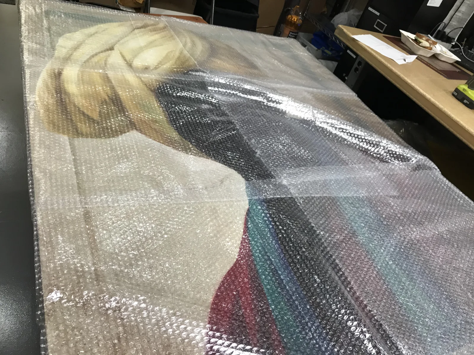 Oversized artwork covered with protective bubble wrap