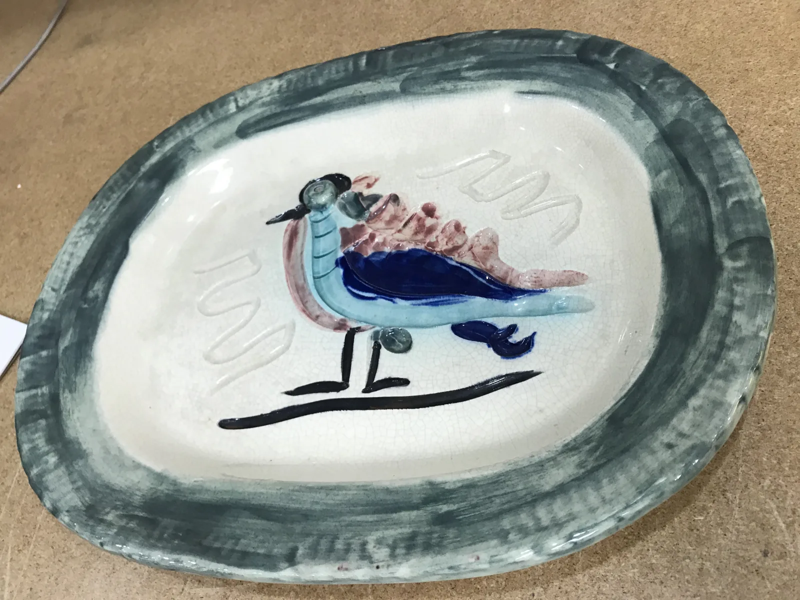 Decorative ceramic plate before protective packing