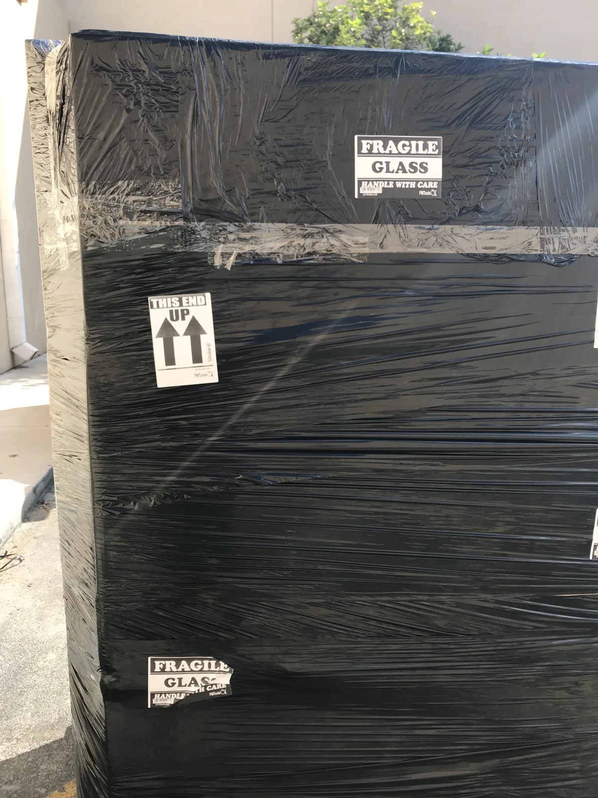Large freight piece wrapped and labeled for careful handling