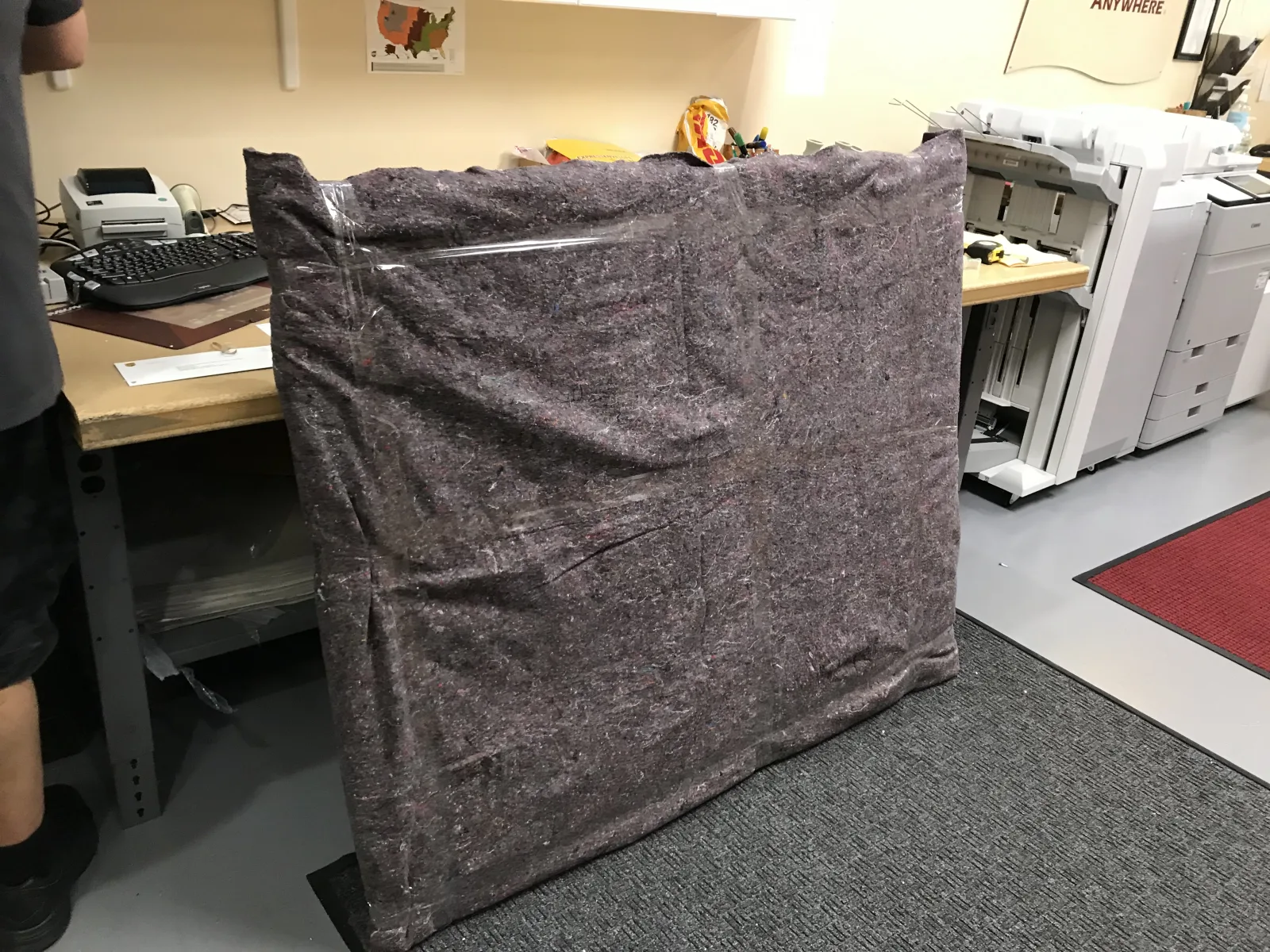 Large flat item protected with a moving blanket