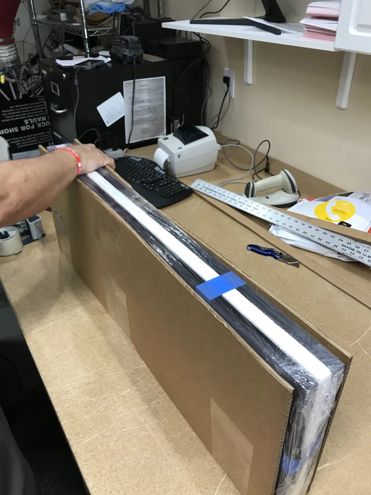 Edge and corner protection applied to framed artwork