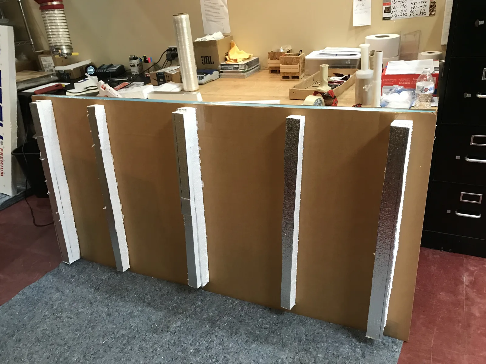 Reinforced protective panels prepared for framed artwork