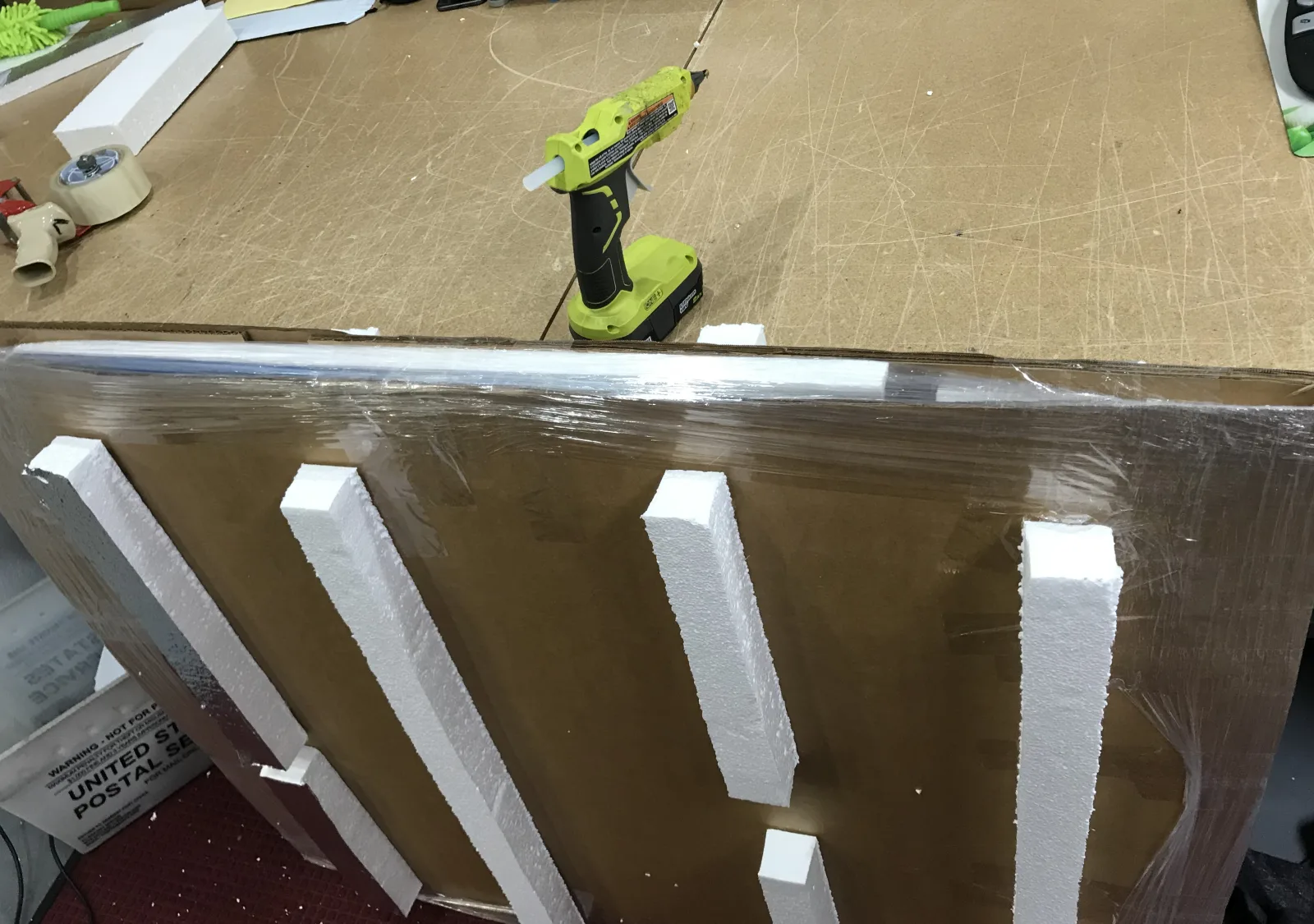 Large artwork protected with reinforced panels and foam spacers
