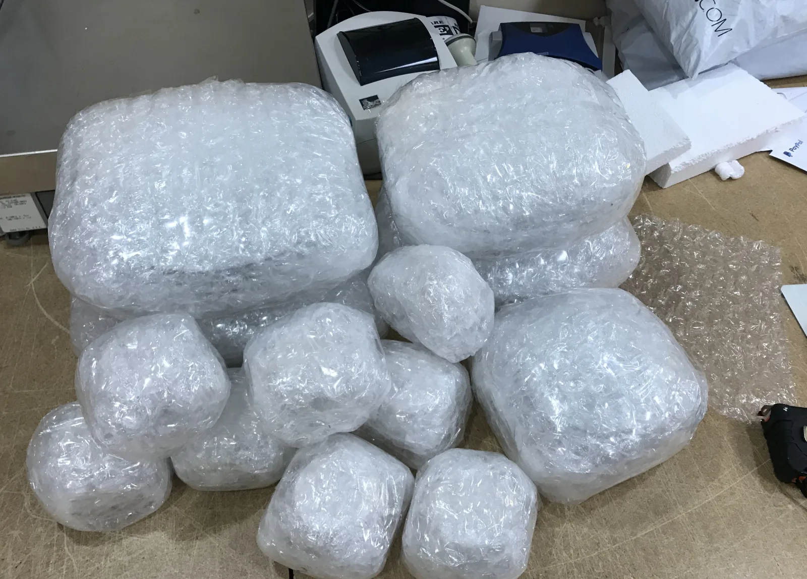 Multiple household items wrapped and ready for boxing