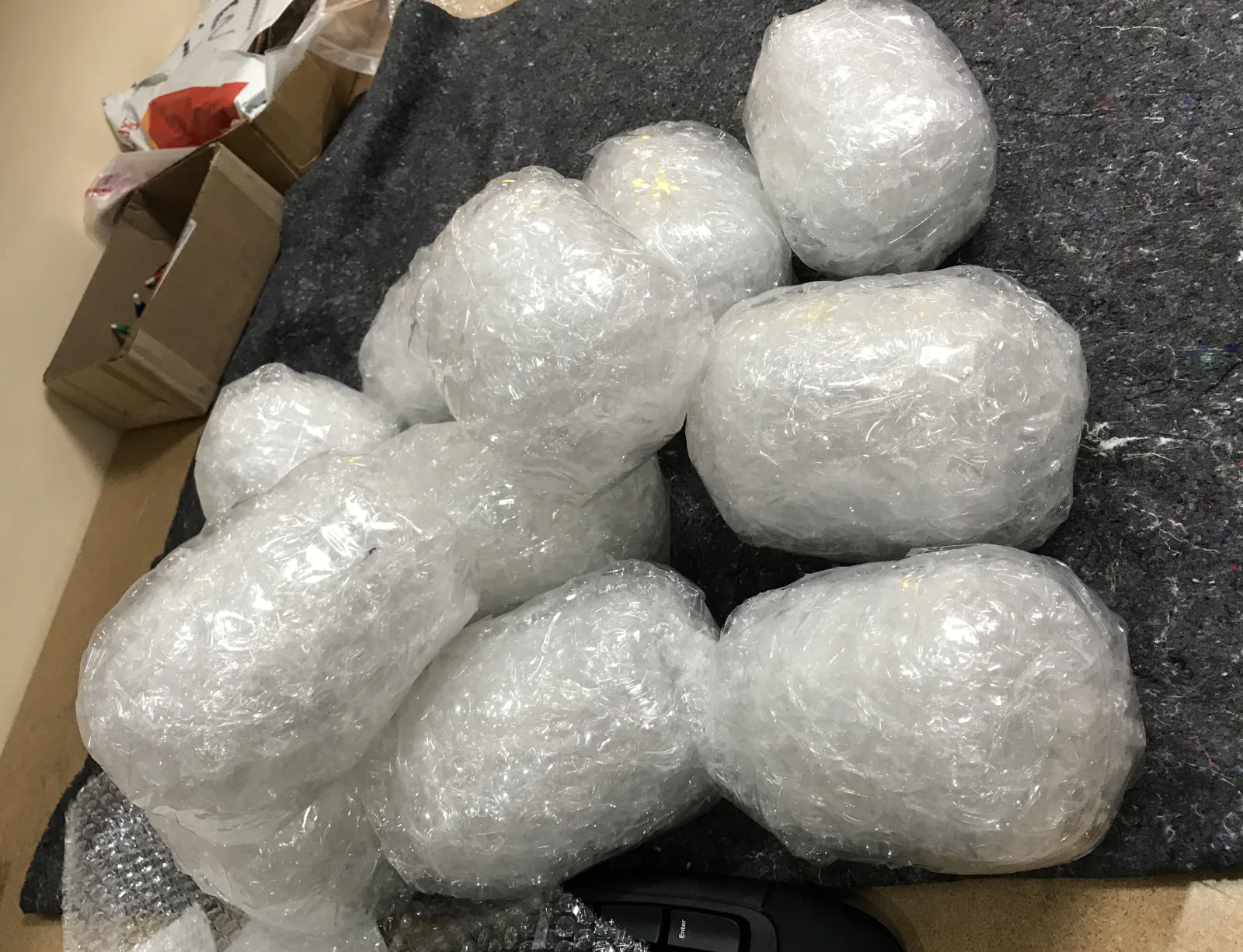 A group of forgotten items wrapped individually for return shipping