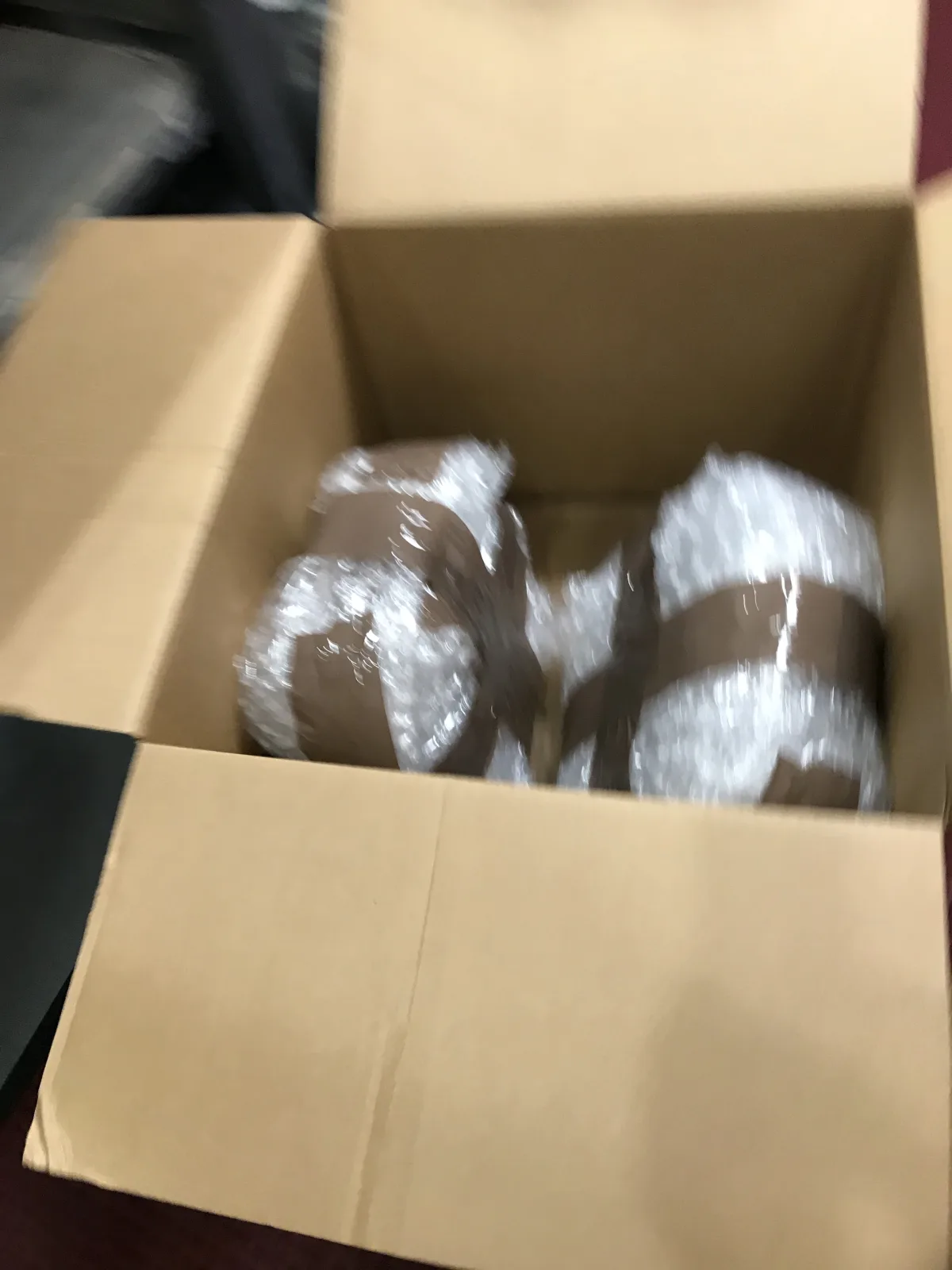 Several return items individually wrapped inside a shipping carton